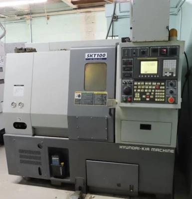 HYUNDAI-KIA SKT100 CNC TURNING CENTER, 12 POS. TURRET, 6000RPM, 21.7" SWING, 8377LBS - undefined