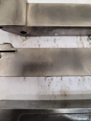 LOT OF 3 TOOL HOLDERS: ISCAR MVJNR 16-3, GHMR 25.4, AND KENNAMETAL NEL-205D - undefined